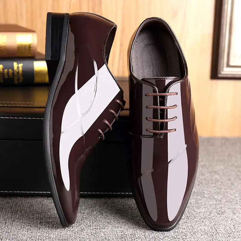 Men’s classic pointed toe leather business shoe in black patent leather with a glossy finish and white toe panel.