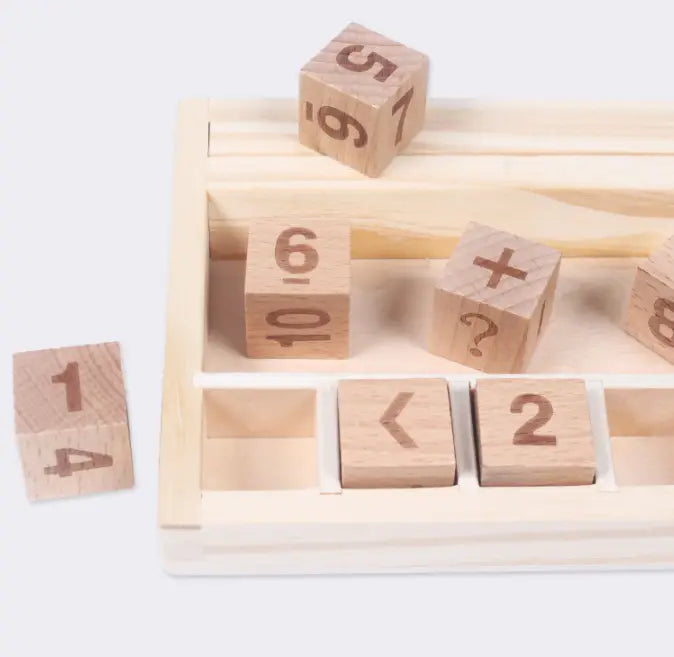 Light-colored wooden educational number and addition symbol blocks organized in a matching tray from the wooden math learning set.