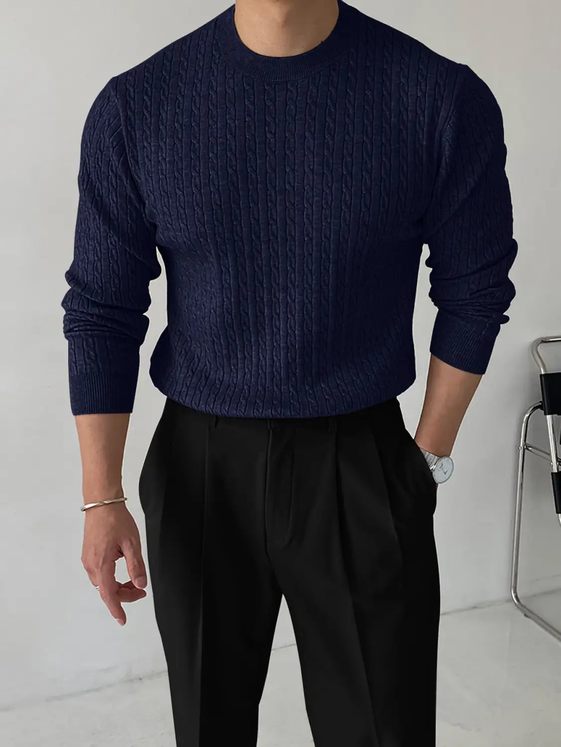 Navy blue thick cable knit turtleneck sweater for men made of warm wool blend material.