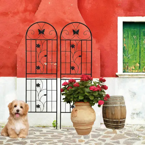 Black wrought iron garden gate featuring decorative butterfly and floral patterns in a rustproof metal garden trellis 2 pack 71in.