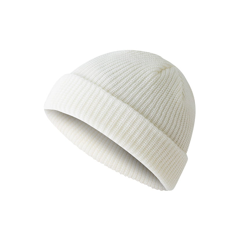A soft white ribbed knit beanie with a folded cuff made of wool, featured as a dark gray ribbed wool beanie hat.