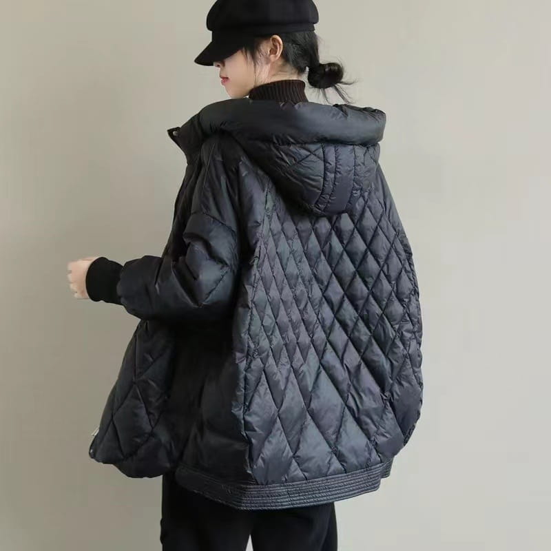 Black quilted white duck down puffer jacket with diamond-stitched pattern and attached hood designed as a loose hooded winter coat.