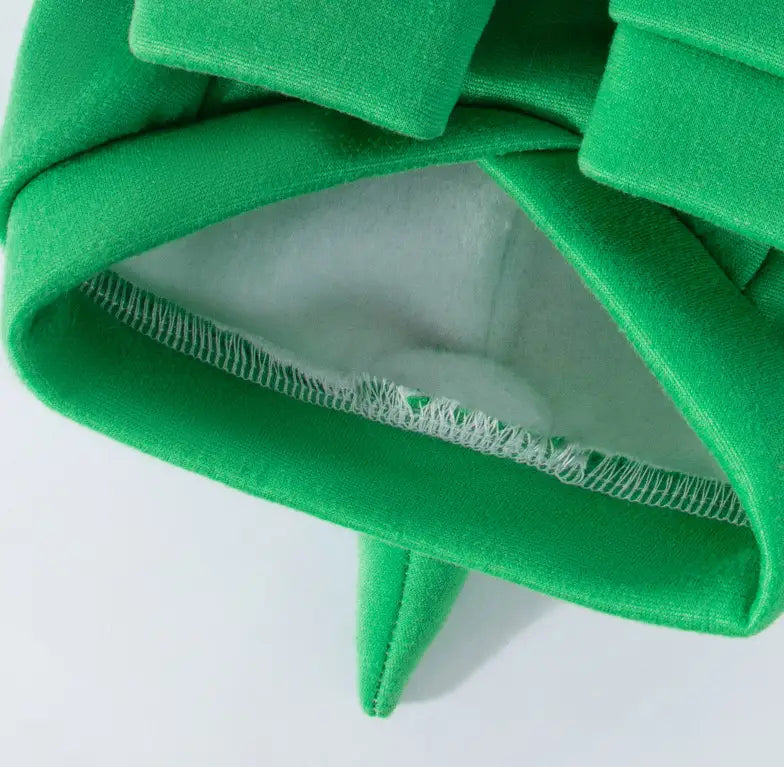 bright green velvet dinosaur cat hoodie plush pet costume with a plush layered ruffle design and white inner lining shown from the back side