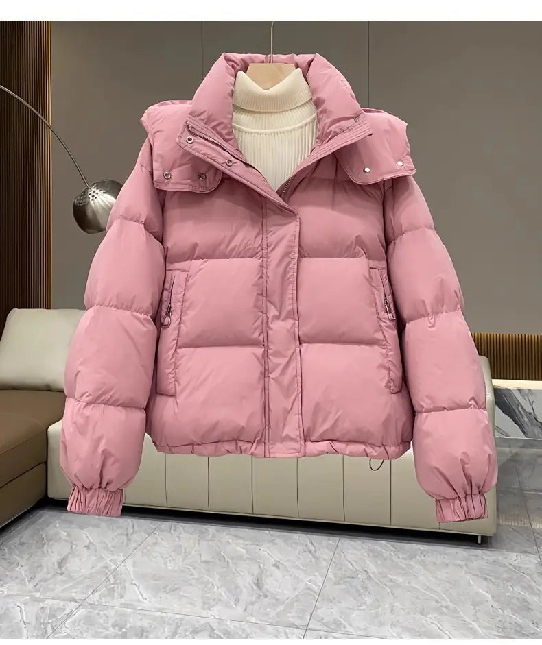 Pink women puffer jacket hooded quilted winter coat featuring a quilted design and adjustable cuffs.