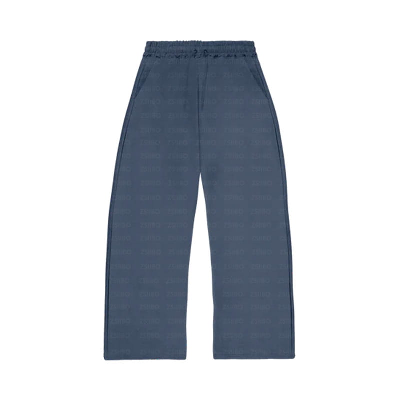 Pantalon noir à jambes larges bleu, avec un motif texturé discret et une ceinture élastiquée, issu de l’ensemble oversize unisexe streetwear comprenant un sweat à capuche et un pantalon de survêtement.