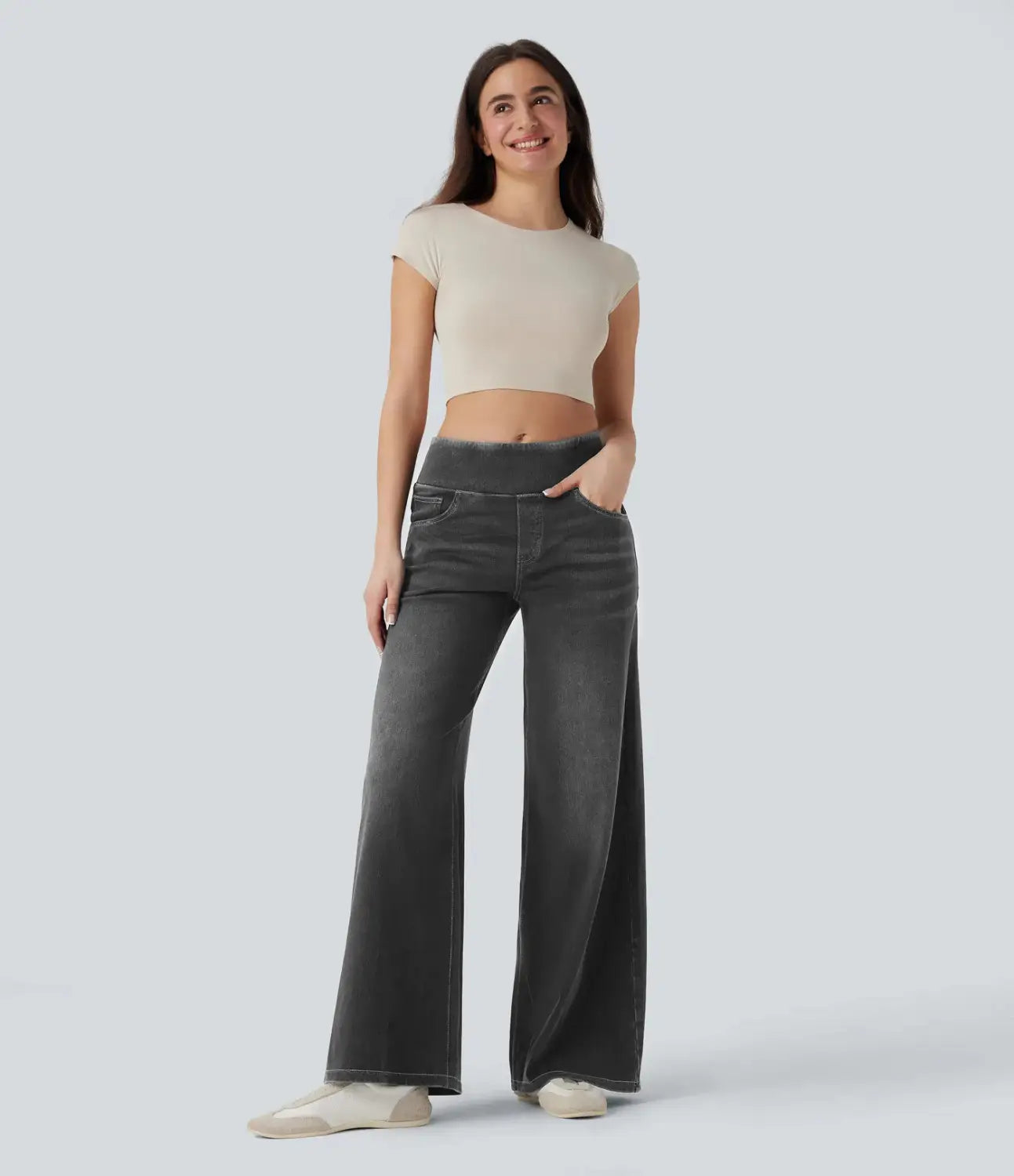 Dark gray wide leg stretchy high waisted jeans with subtle fading and a comfortable fit.