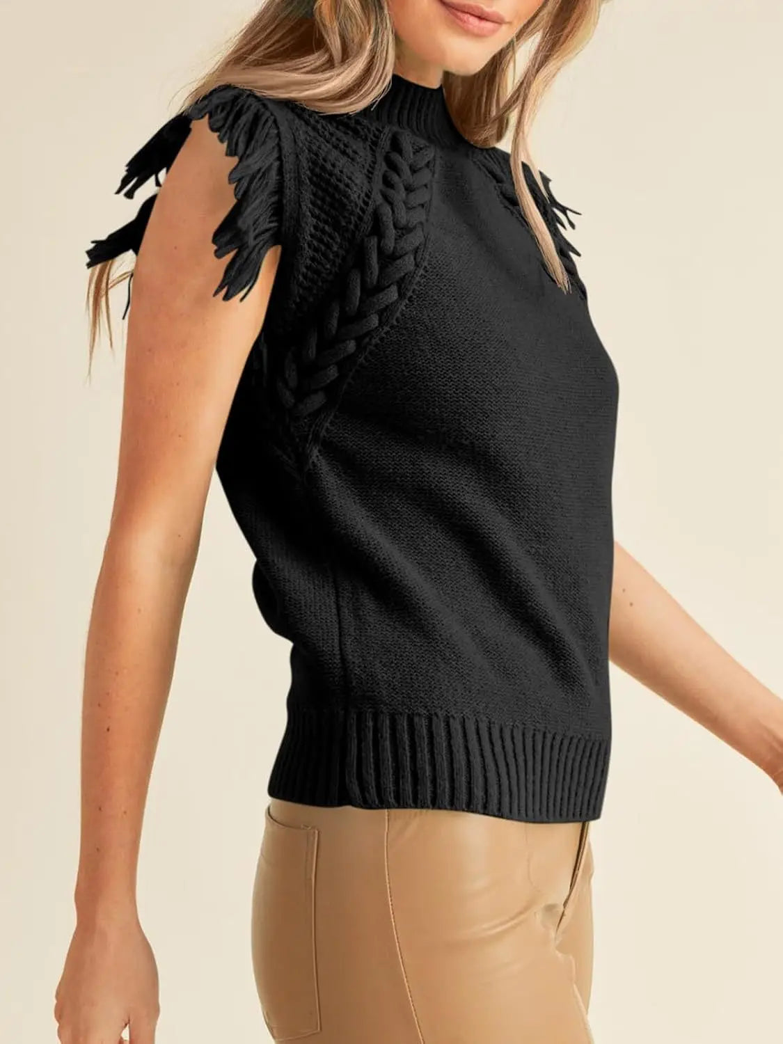 Black hand-woven sleeveless knit sweater vest featuring fringed shoulder details and a braided panel.
