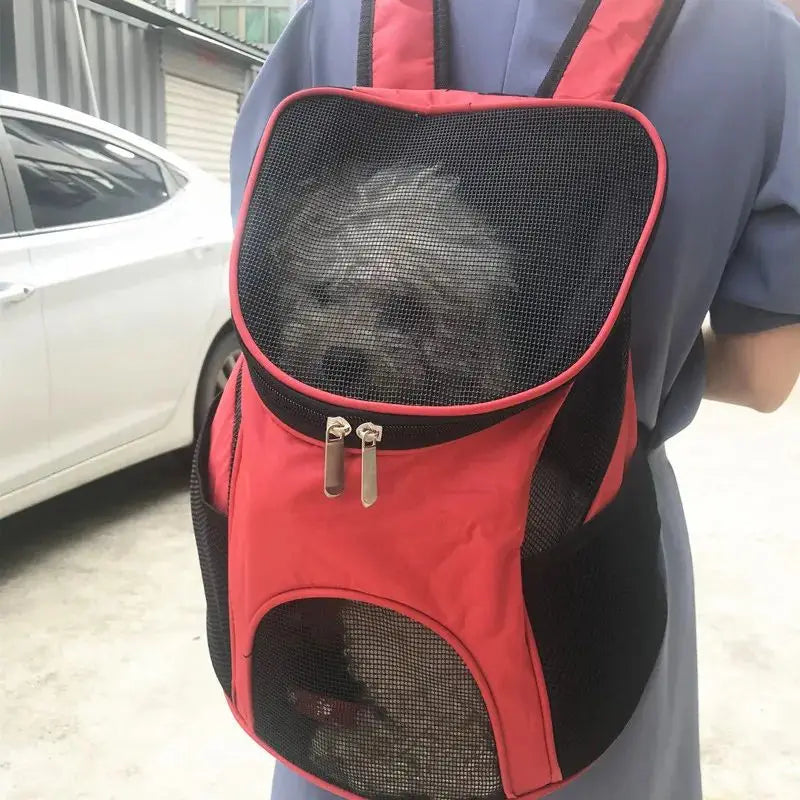 red and black breathable mesh dog carrier backpack with adjustable straps for small pet travel shown from the back side