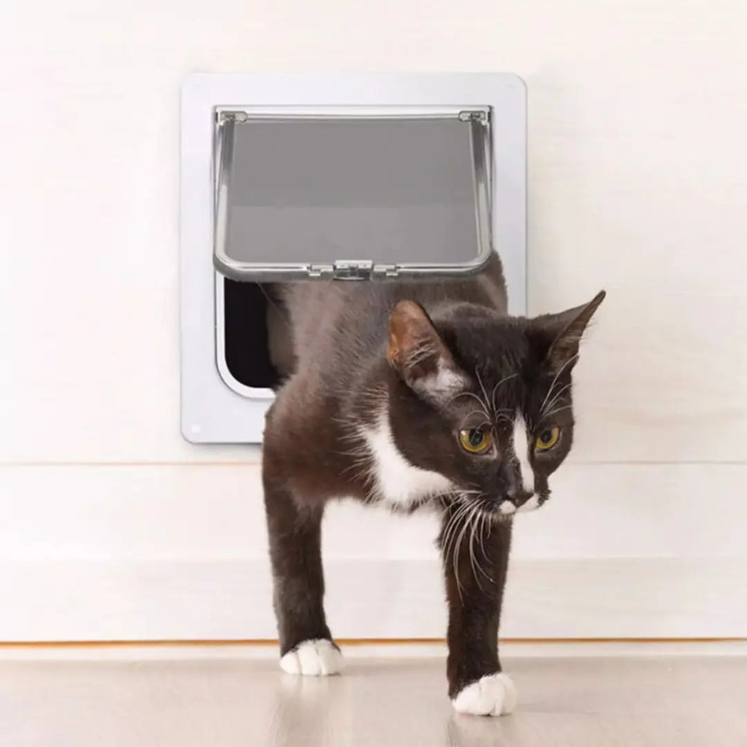 A sleek white xl pet door with a four way locking magnetic silver toned flap and hinge mechanism for dogs and cats.