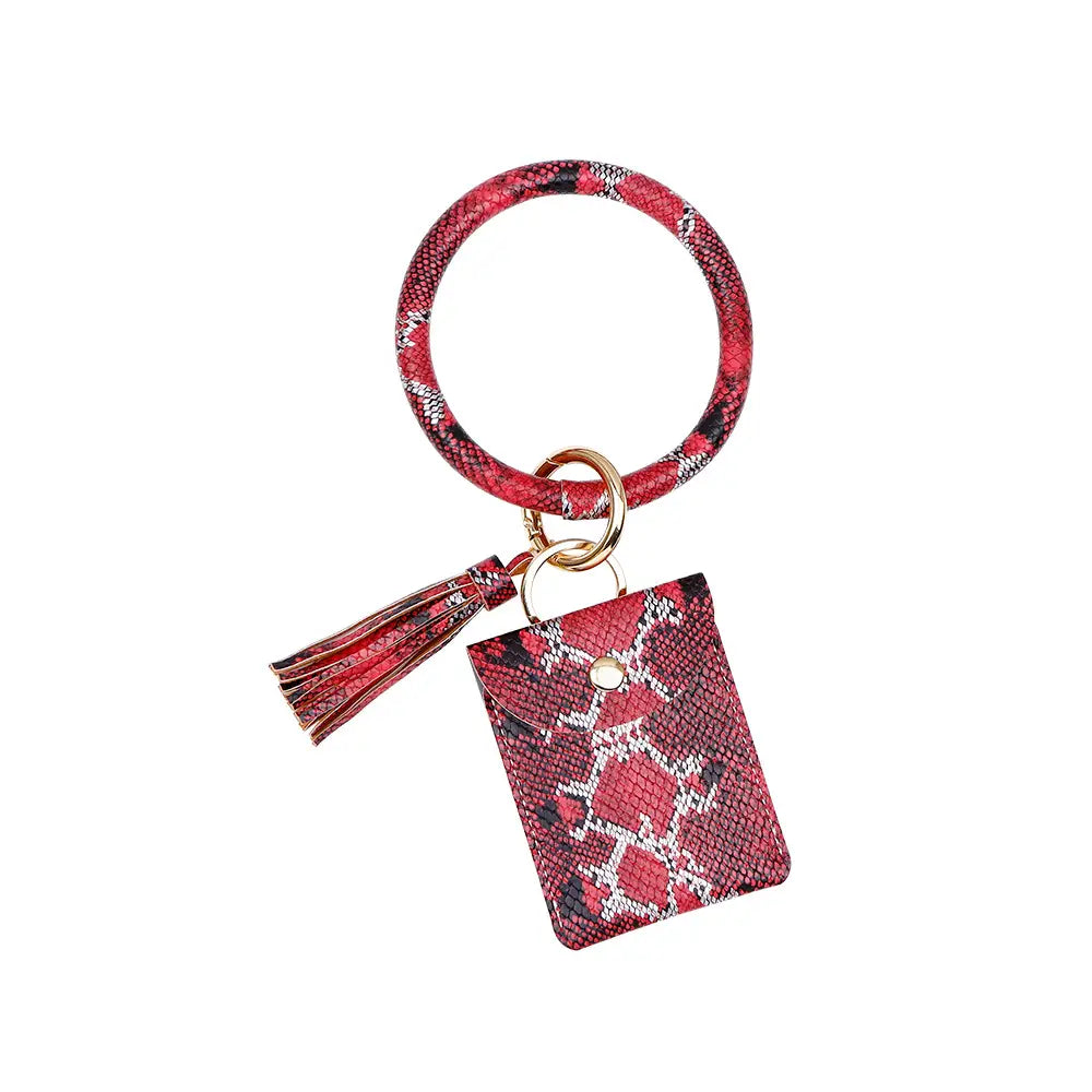 Porte-cartes avec mousqueton de poignet en cuir rouge, avec motif imprimé serpent, pochette carrée assortie et gland.