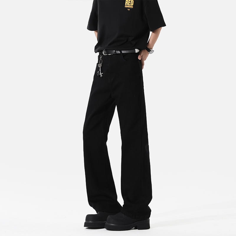 Modern black straight leg bootcut denim jeans featuring a straight cut with subtle stitching details on wide-leg trousers.