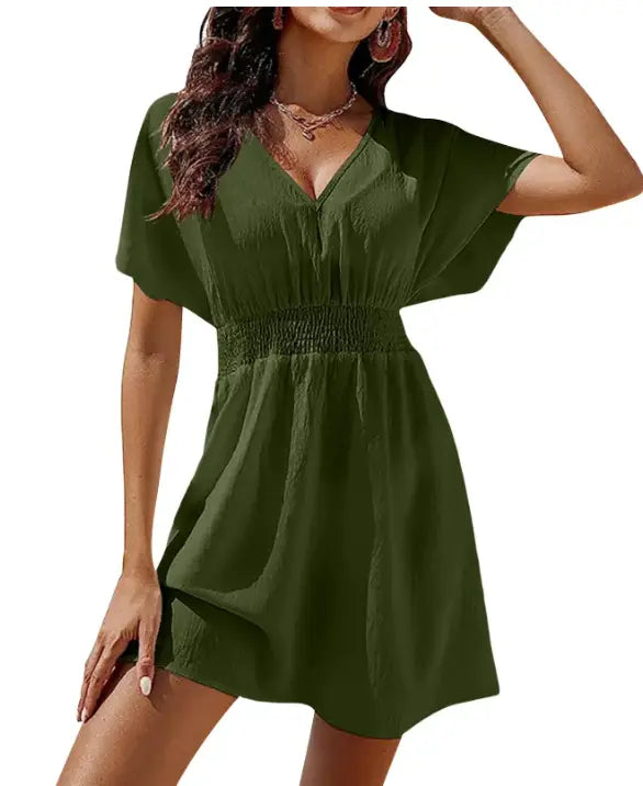Olive green chiffon v-neck short sleeve dress with smocked waistband and pleated skirt.