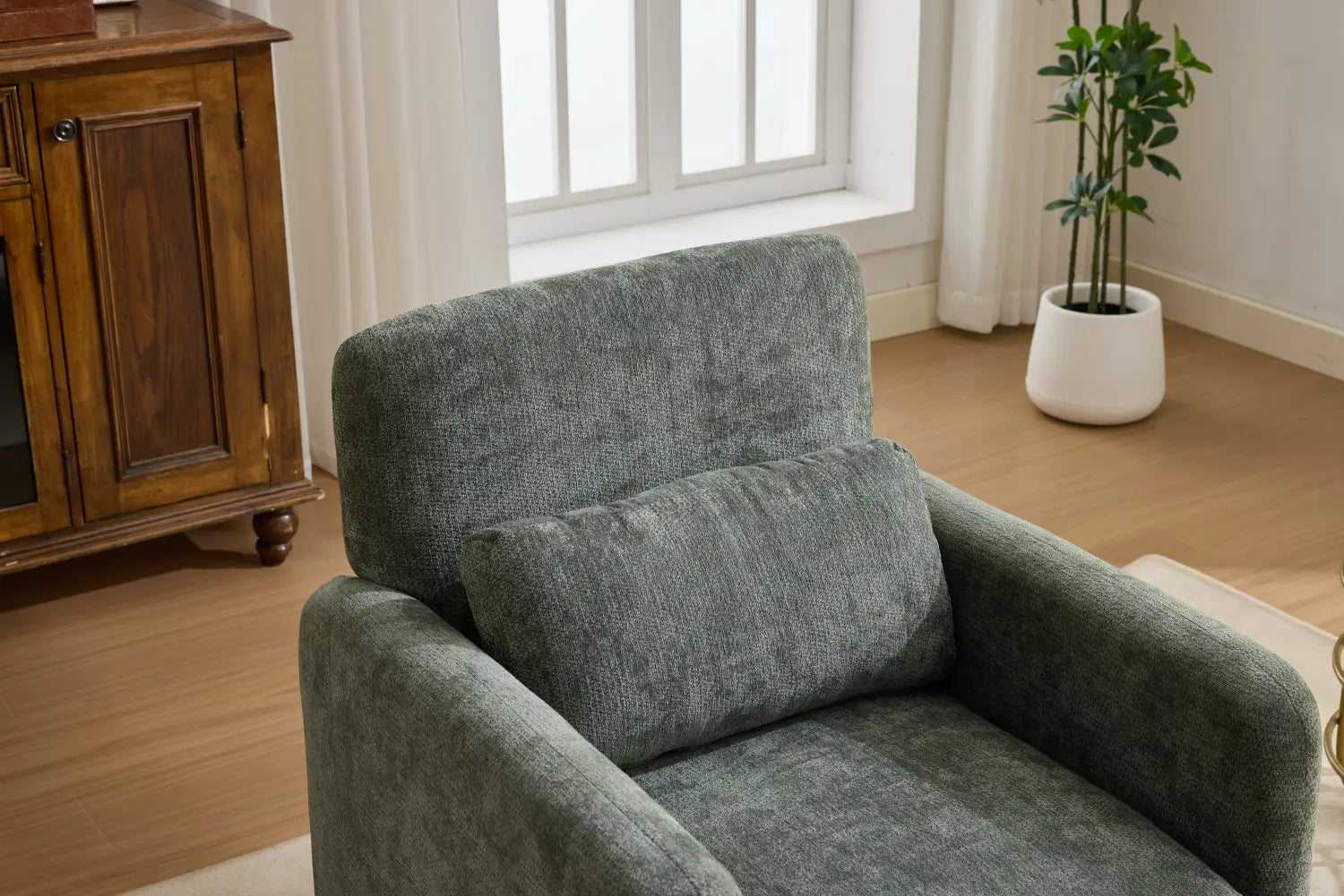 A cozy gray boucle fabric accent chair with modern textured upholstery and a matching cushion.