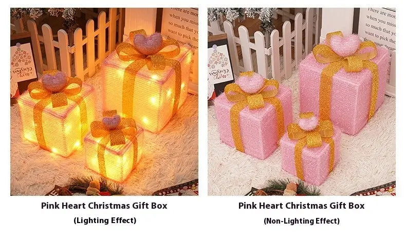 led christmas gift box set featuring pink heart-shaped boxes with glittery gold ribbon bows available in illuminated and non-illuminated versions.