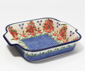 Hand painted 9x9 ceramic square baker with red cherry and blue floral design and navy blue rim and dotted base pattern