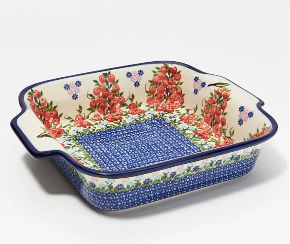 Hand painted 9x9 ceramic square baker with red cherry and blue floral design and navy blue rim and dotted base pattern