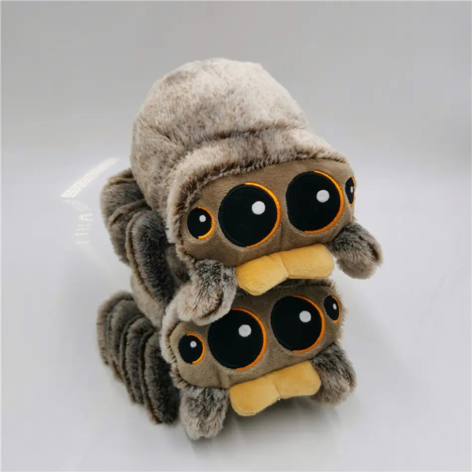 fuzzy brown and beige plush toy cartoon spider stuffed animal doll with oversized black eyes outlined in orange and a yellow mouth made of soft material from mainland china.