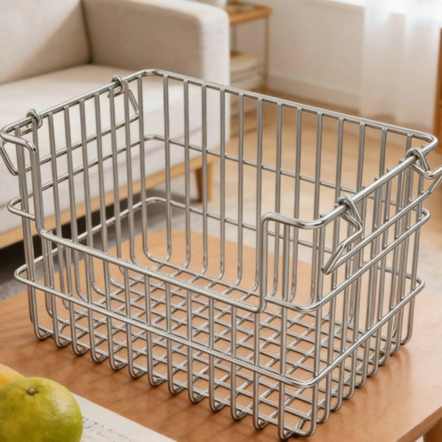 Rectangular stainless steel wire storage basket organizer with reinforced handles and a grid pattern for durable and organized storage.