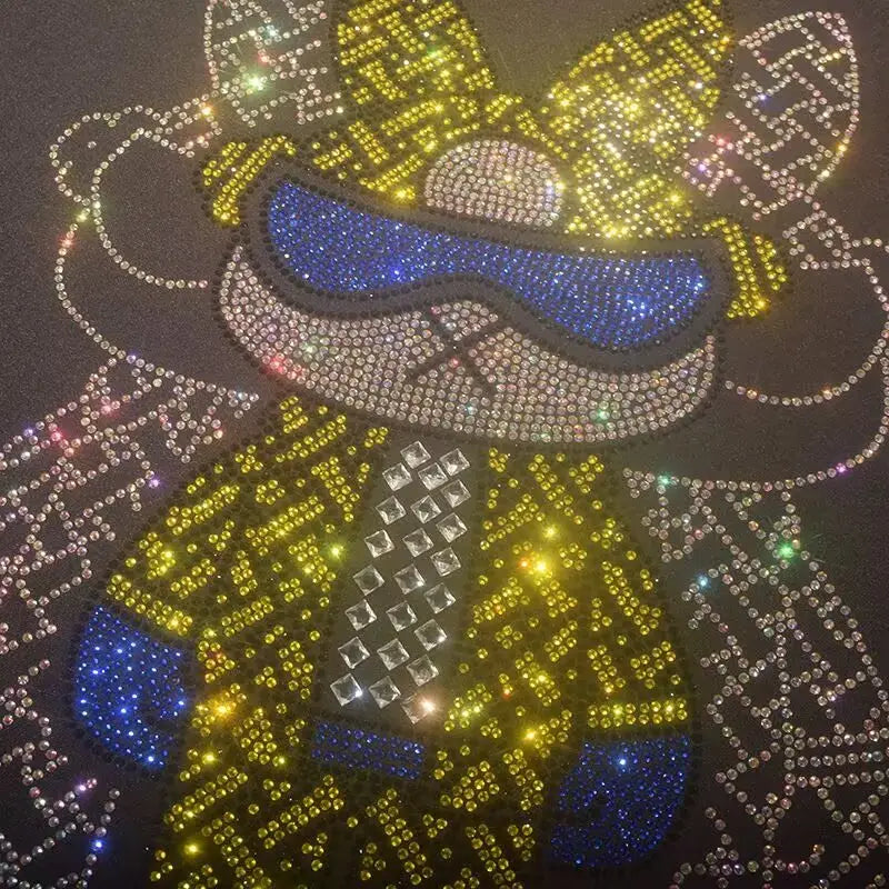 men rhinestone devil bear graphic tee featuring a sparkling yellow and blue rhinestone-embellished cartoon character design on dark fabric.