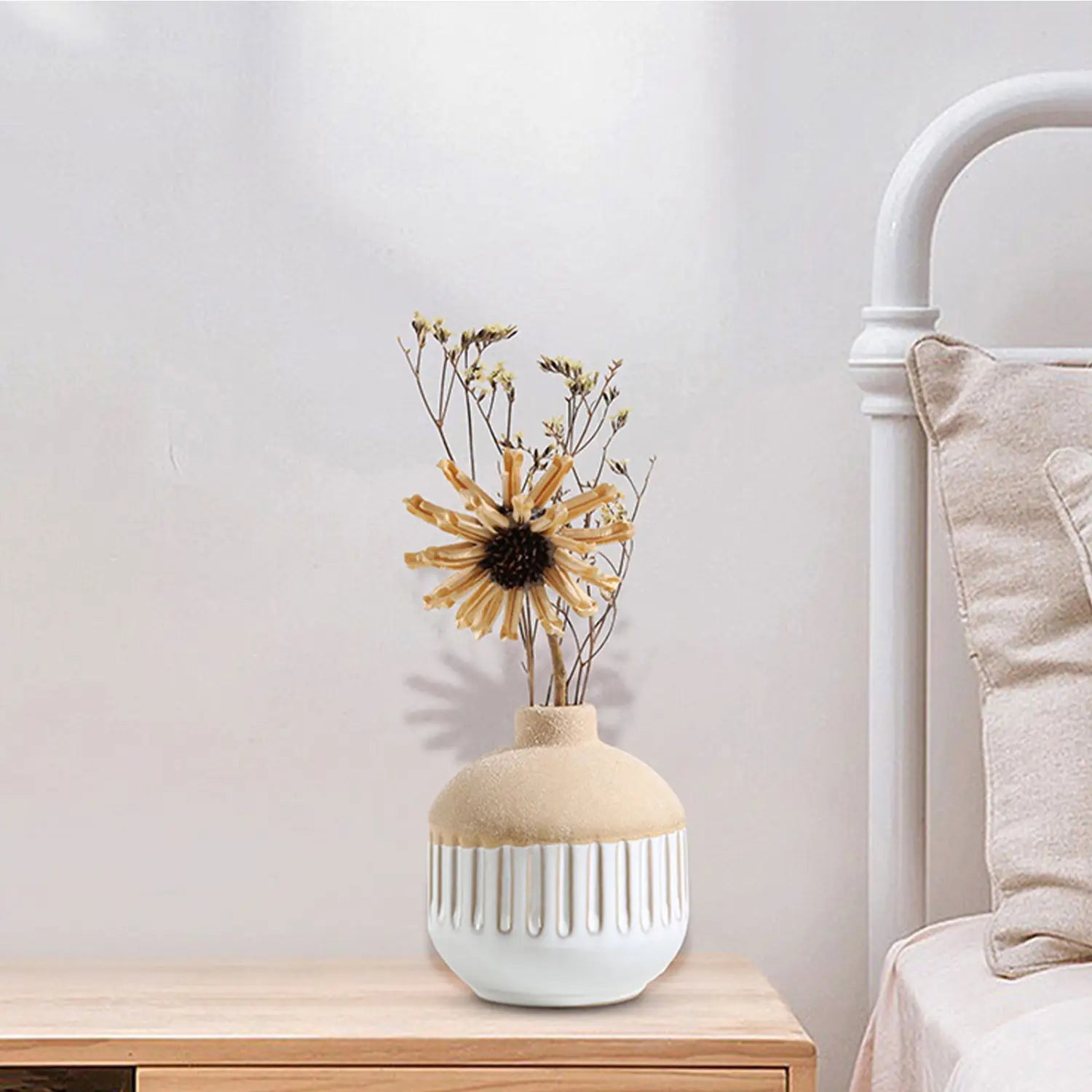 Beige and white ceramic flower vase with vertical ridged detailing ideal for boho tabletop decor.