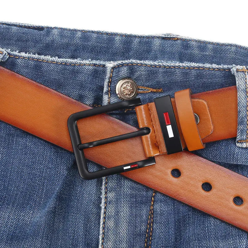 Tan pu leather men’s business belt with a casual black square buckle featuring the Tommy Hilfiger logo.