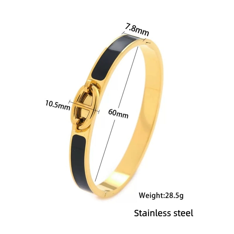 women h bangle gold enamel minimalist bracelet featuring a gold-toned stainless steel bangle with a sleek black enamel stripe and a distinctive interlocking clasp design for a fashion bracelet minimalist look.
