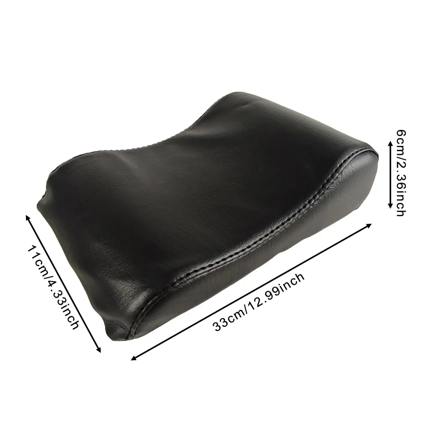 black leather neck support pillow with stitched edges and contoured shape designed for pilates reformer use