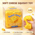 A bright yellow cheese squeeze toy with holes and a cute face viewed from the front for stress relief