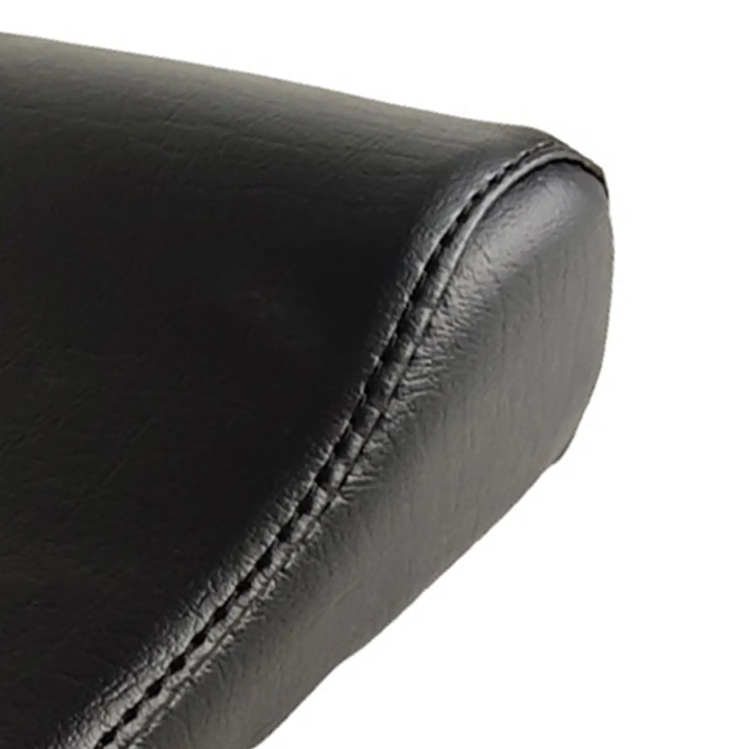 Black leather neck support pillow with precise stitching along the curved edge designed for Pilates reformer use.