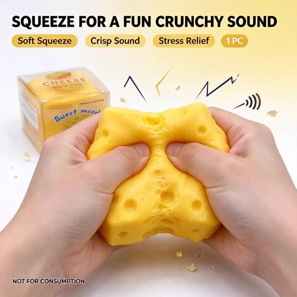 Yellow cheese-shaped slow rising stress relief fidget toy with holes resembling swiss cheese shown from front angle