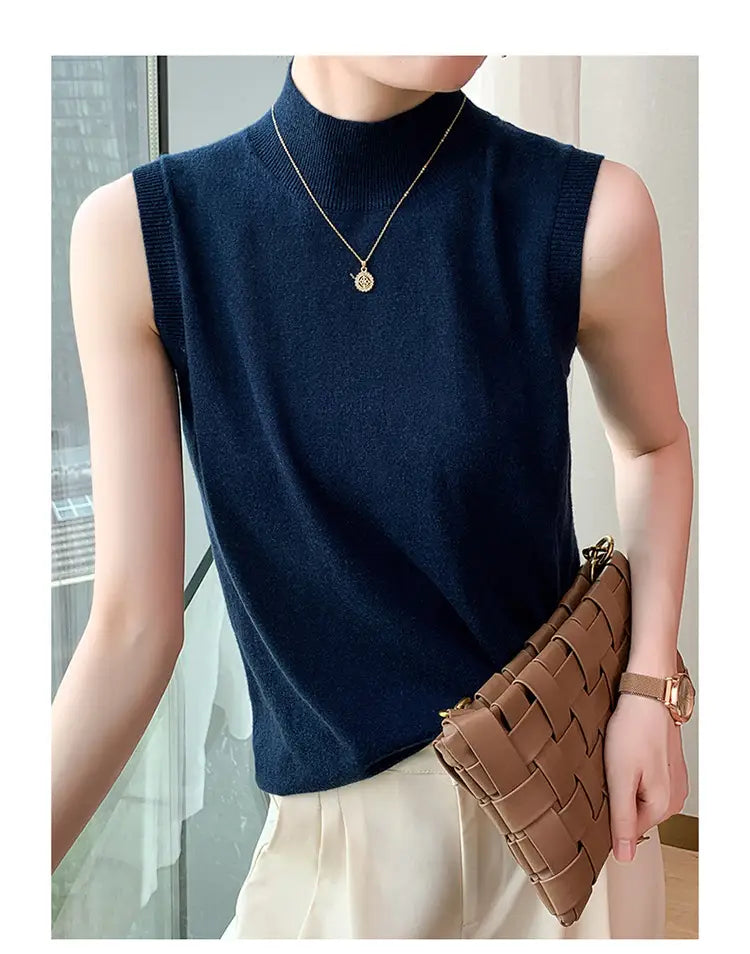 navy blue sleeveless knit wool turtleneck sweater vest displayed from the front.