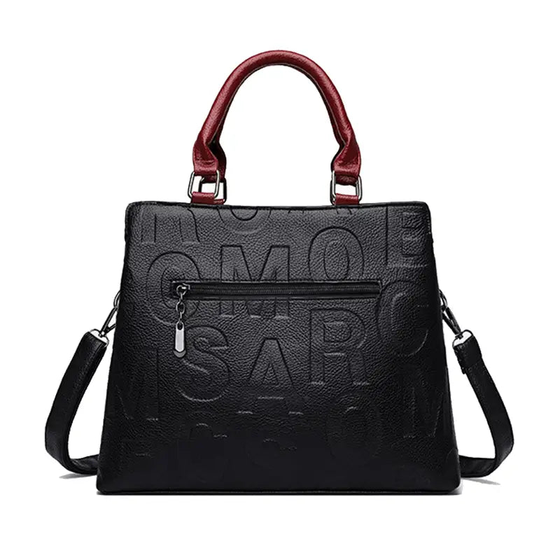Black leather crossbody handbag with embossed lettering and contrasting red top handles in pu leather satchel style1 style2.