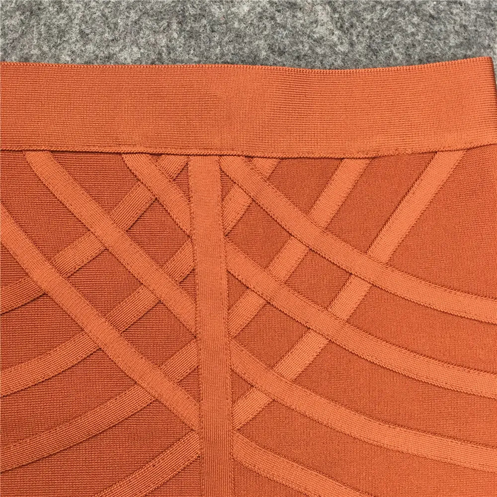 Jupe midi bandeau pour femme à taille haute, style crayon, en tissu tricoté orange, avec un motif géométrique en treillis et une ceinture côtelée.
