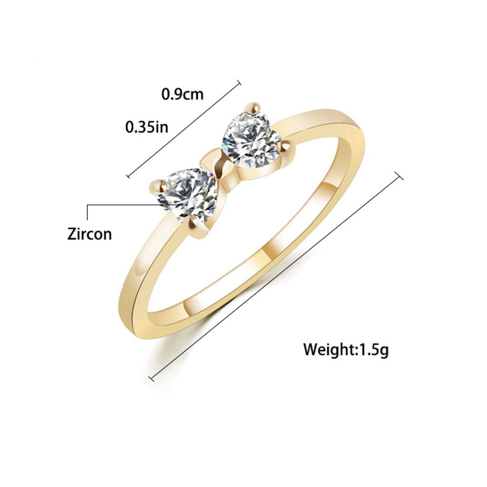 Bague de mariage en argent sterling, de ton or, présentant un design en nœud avec deux pierres en oxyde de zirconium cubique étincelantes.