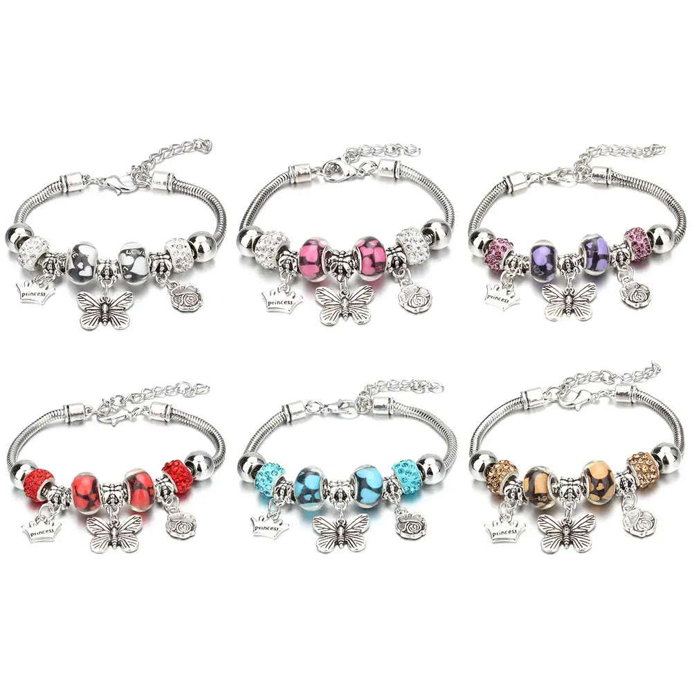 six silver-toned charm bracelets featuring metallic and colored beads with dangling butterfly charms showcasing a beaded bracelet design in a charm bracelet collection for women