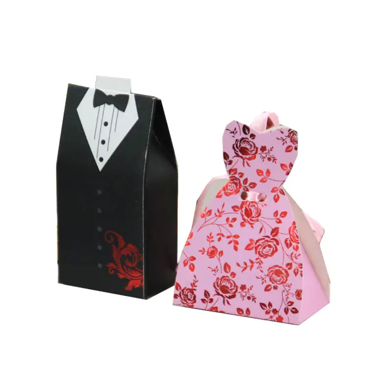 pink floral-patterned paper wedding favor candy box with red roses and black bow tie design paired with a matching black tuxedo-themed box from bride and groom wedding favor candy boxes 30 pcs set
