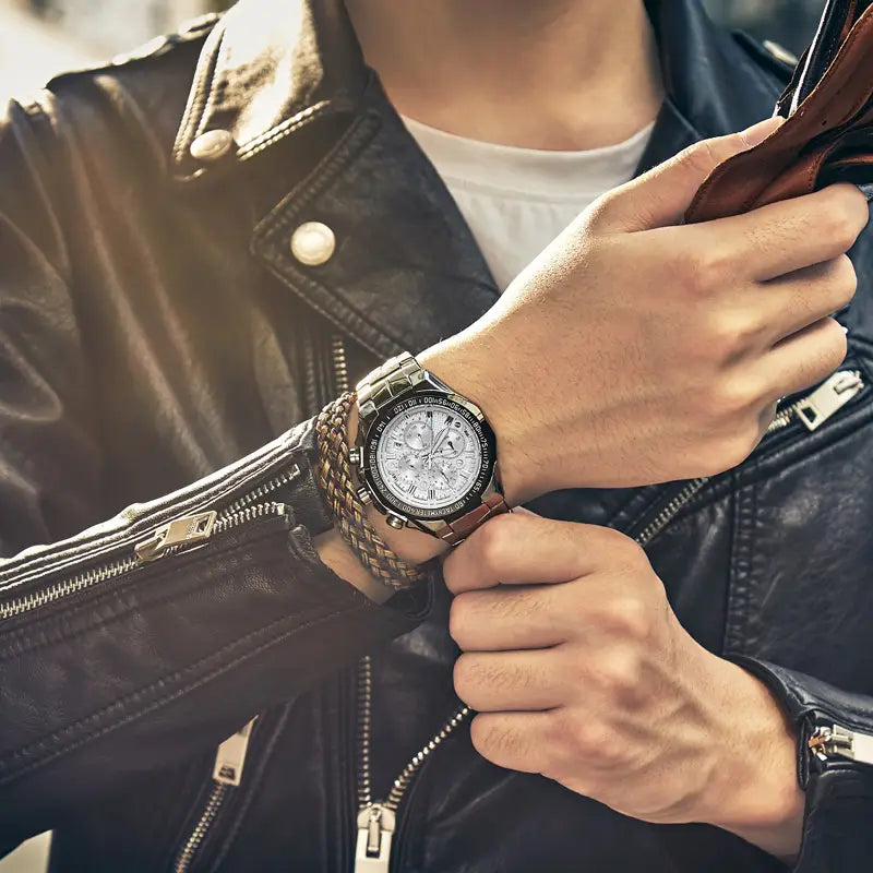 Silver-toned gold chronograph watch for men with a stainless steel luxury timepiece featuring a multi-layered braided leather strap and a detailed dial with roman numerals.