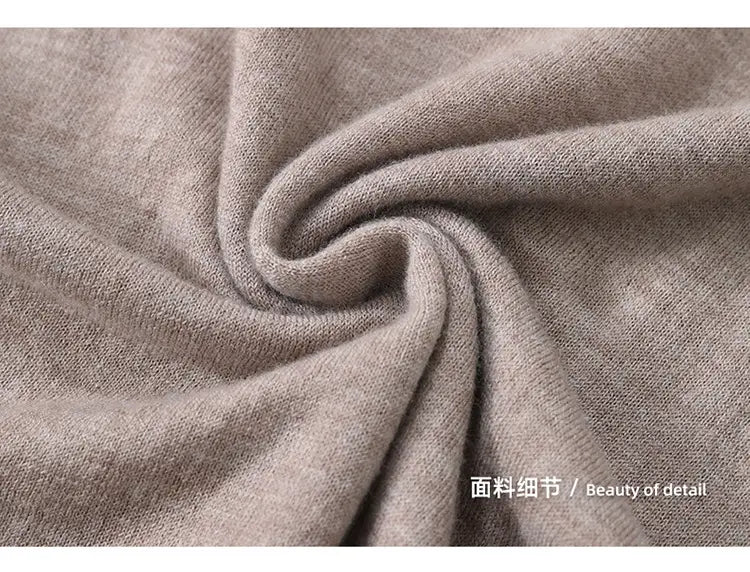 Soft neutral-toned wool turtleneck sleeveless sweater vest featuring a subtle textured knit fabric.