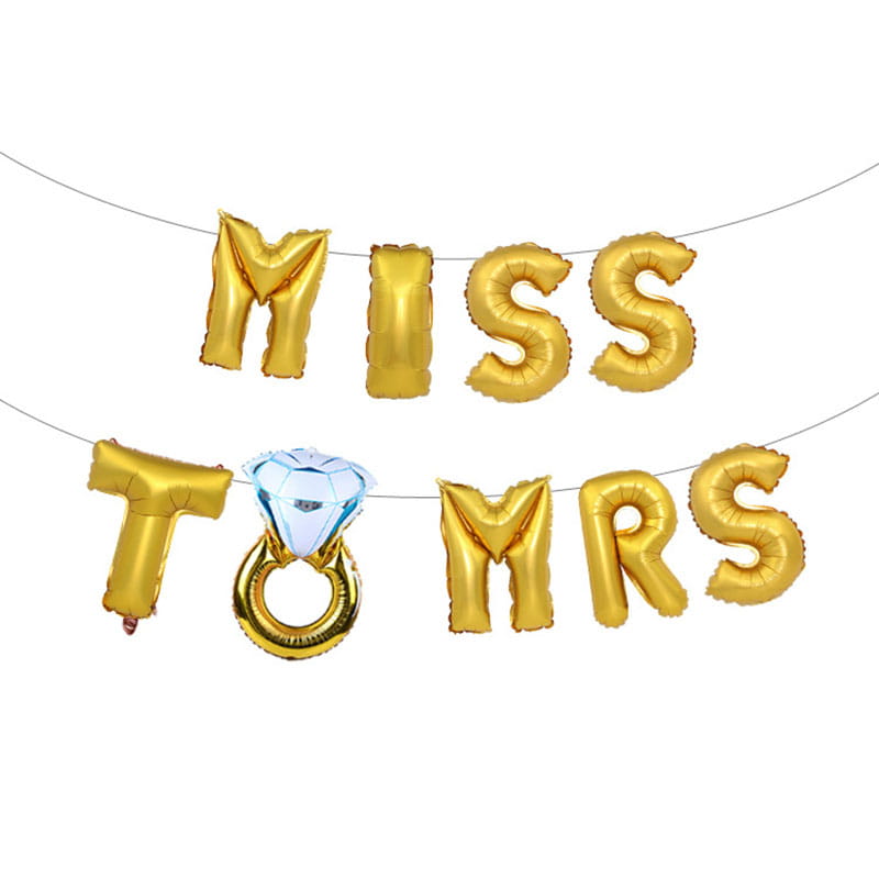 Bride to be foil balloon banner set featuring a gold foil balloon banner spelling miss to mrs with a diamond ring shaped balloon in the center.