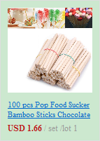 a bundle of light brown bamboo sticks wrapped with thin red string shown with wedding champagne flutes gold heart toasting glasses set