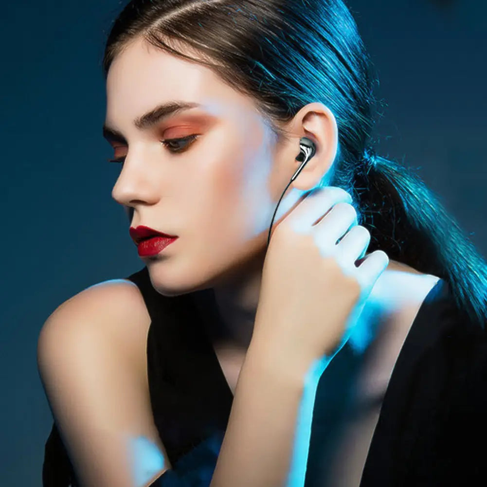 Black wired earphones with mic and bass stereo feature a sleek minimalist design and thin wire for clear audio and comfortable use.