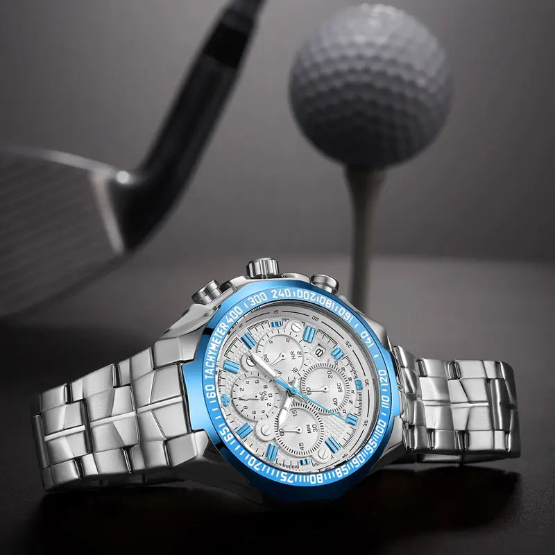 Gold chronograph watch men stainless steel luxury timepiece featuring a silver-toned chronograph with a vibrant blue bezel and matching accent details on the dial and a stainless steel link bracelet.