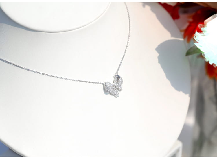 silver bowknot zircon necklace and earrings set featuring a delicate silver butterfly pendant necklace with sparkling gemstones