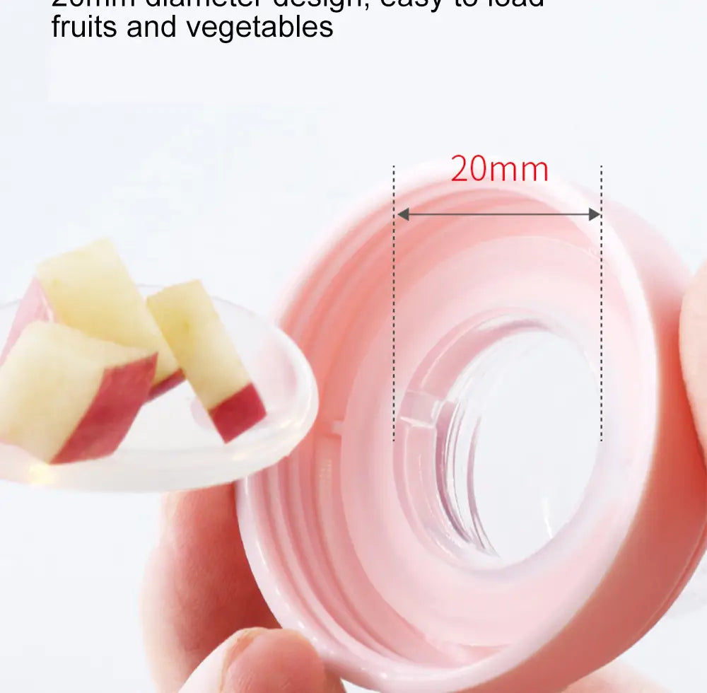 Rosa Silikon-Babysqueeze-Feedingflasche und Löffelspender mit einem Kunststoff-Loader für Obst und Gemüse mit einer Öffnung von 20 mm Durchmesser.
