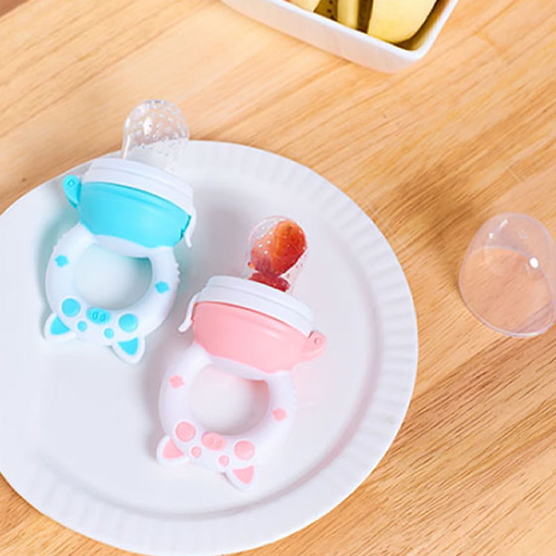Two colorful silicone baby fruit feeders and teethers in light blue and white with cat ears and pink and white with paw prints designed for soothing teething infants.