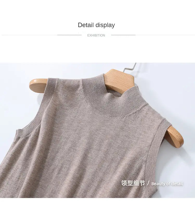 Beige knit wool turtleneck sleeveless sweater vest with high neckline and ribbed trim.
