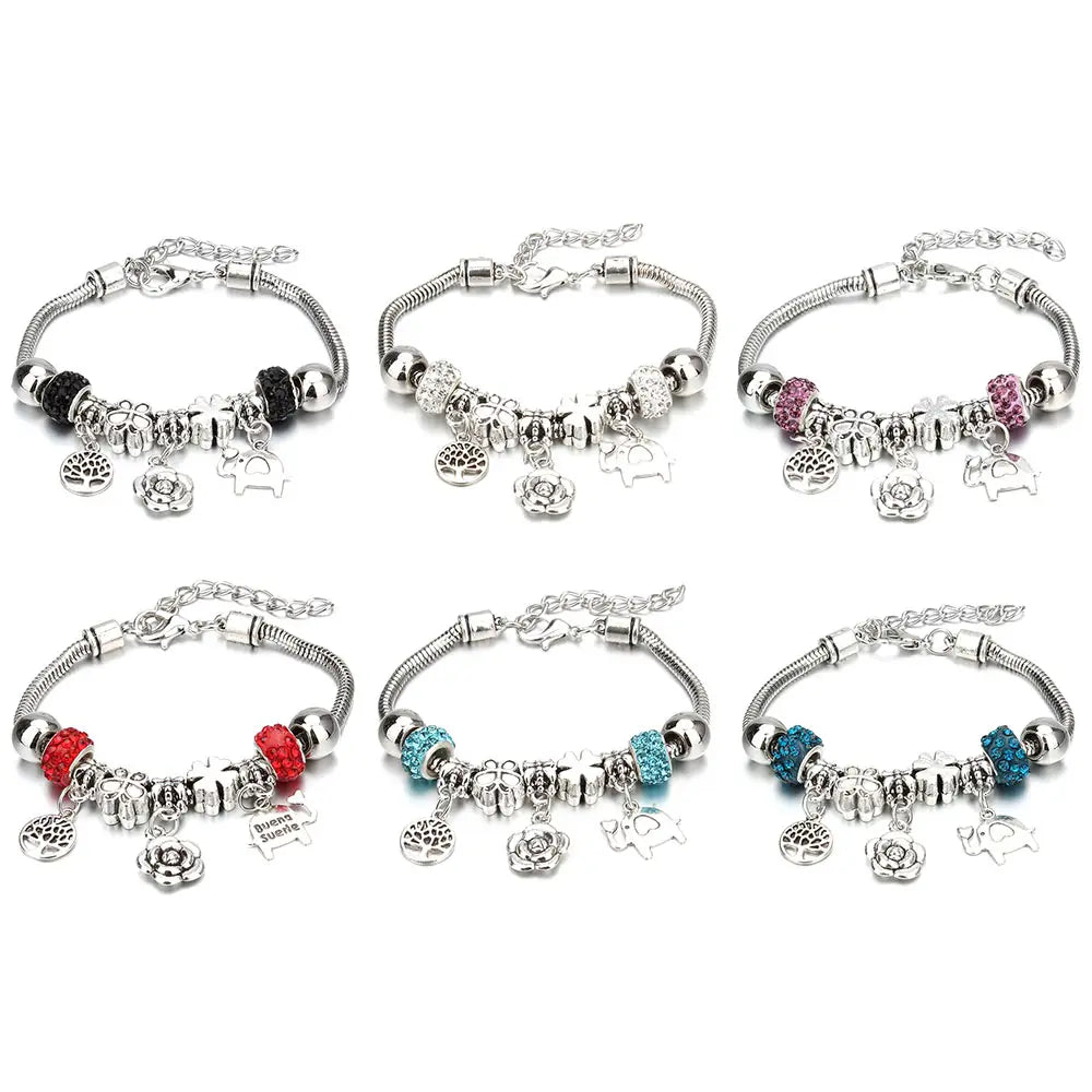 six silver-toned charm bracelets featuring snake chains with assorted beads and dangling elephant and tree charms in black red pink and turquoise designed as beaded charm bracelets for women with crown and key charms