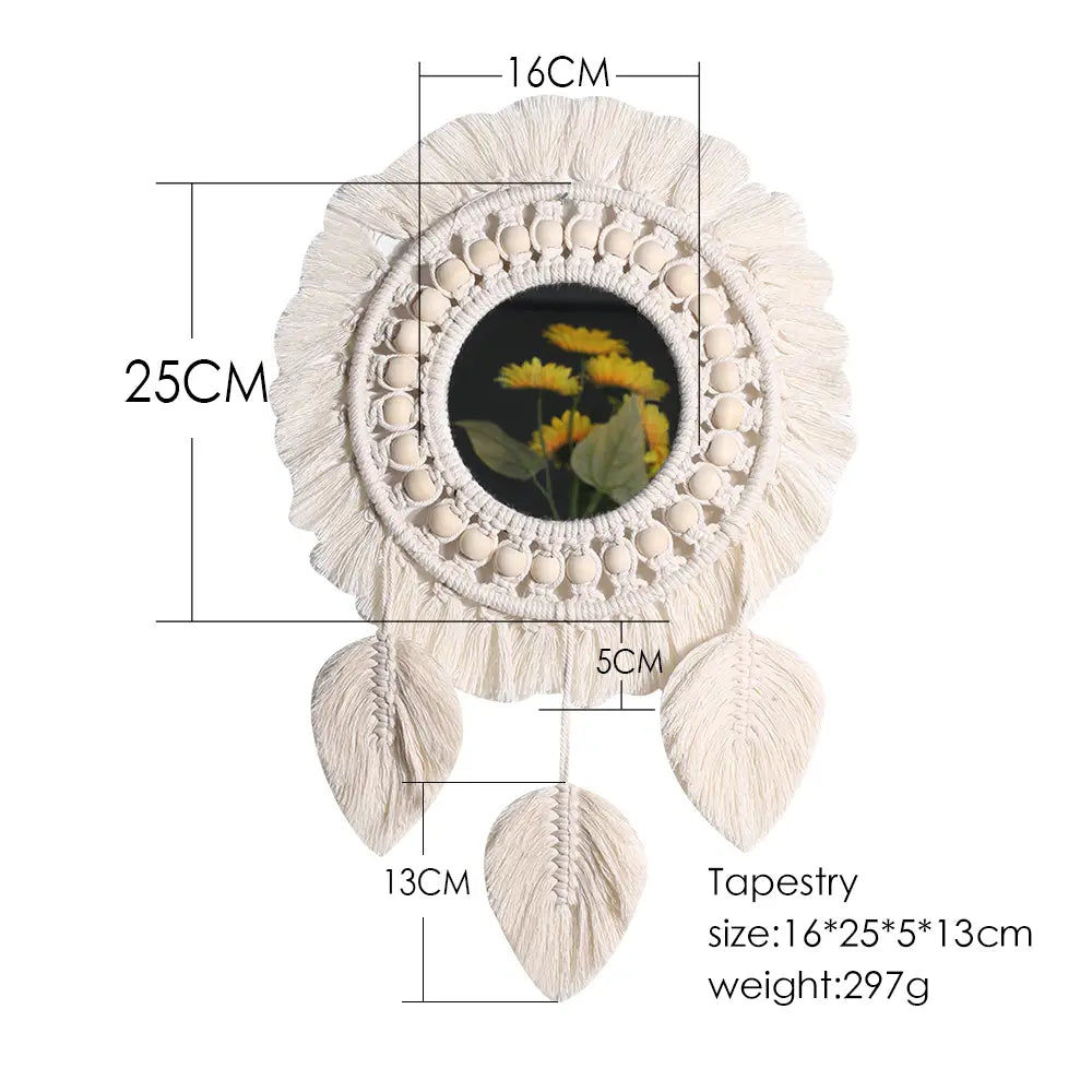 Cream-colored boho macrame wall mirror with a circular mirror framed by woven beads and tassels, featuring three leaf-shaped fringe pieces for living room home decor.