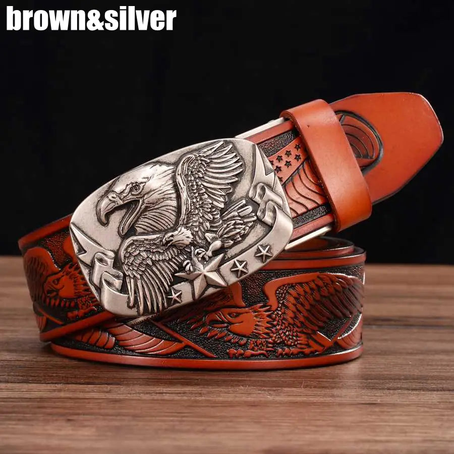 Brown leather men’s ratchet belt featuring a detailed silver eagle buckle with engraved wings and stars.