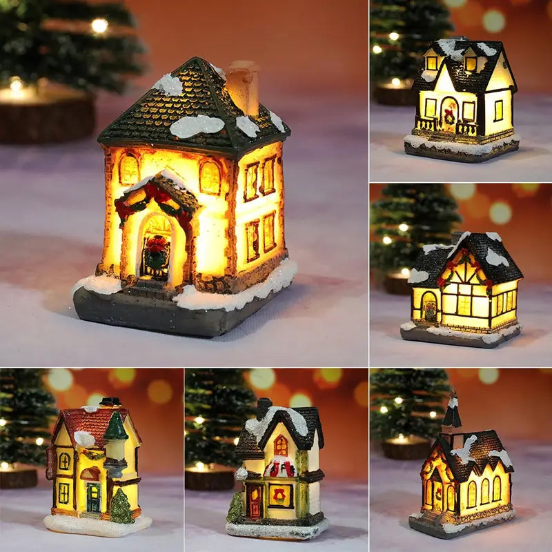 Maison de village de Noël miniature illuminée à LED, avec un toit blanchit par la neige, des fenêtres lumineuses et des couronnes festives, veilleuse à batterie.